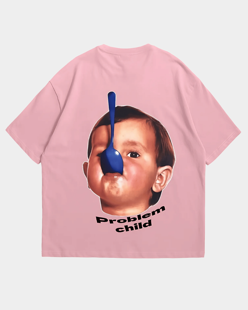 Pink comfortable oversized cotton tee from Gully Projekt featuring graphic of child with spoon on face and text problem child